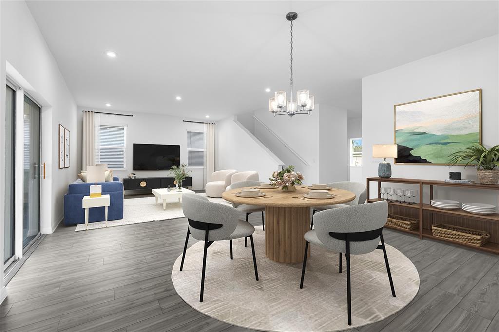 This is a digital rendering of an open-concept living and dining area with gray flooring — 33905 SEATTLE SLEW DRIVE, SORRENTO, FL
