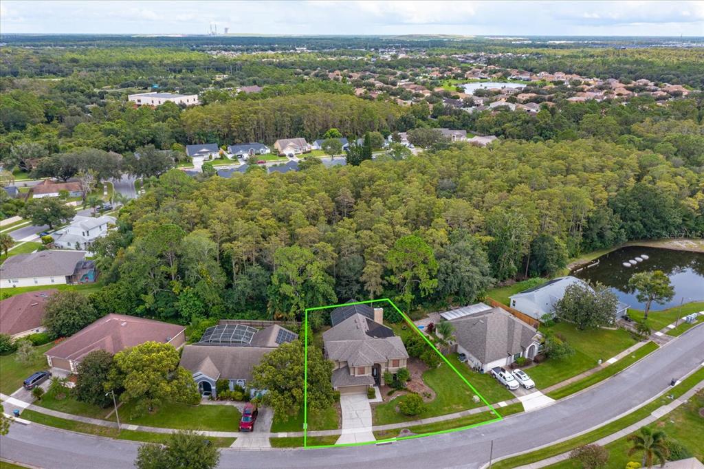 An aerial view shows a suburban house with a green outline on a residential street — 3920 RUNNING WATER DRIVE, ORLANDO, FL