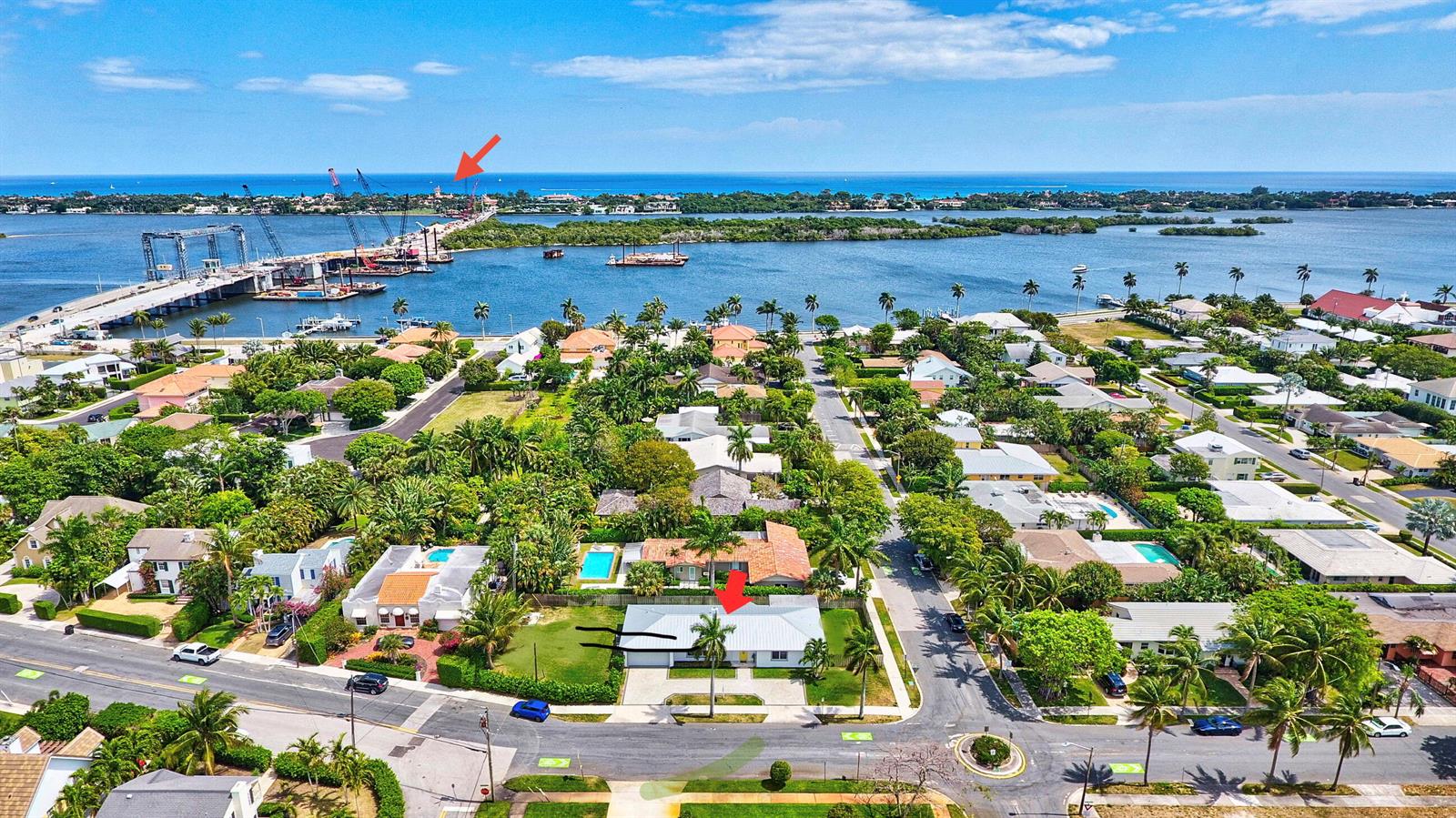 An aerial view of a coastal neighborhood with a house highlighted by a red arrow — 4300 Washington Road, West Palm Beach FL 33405, WEST PALM BEACH, FL