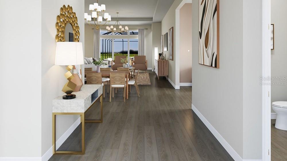 This virtually staged rendering shows a hallway leading into a dining area and living room — 26843 VICTORIA PLACE, PUNTA GORDA, FL