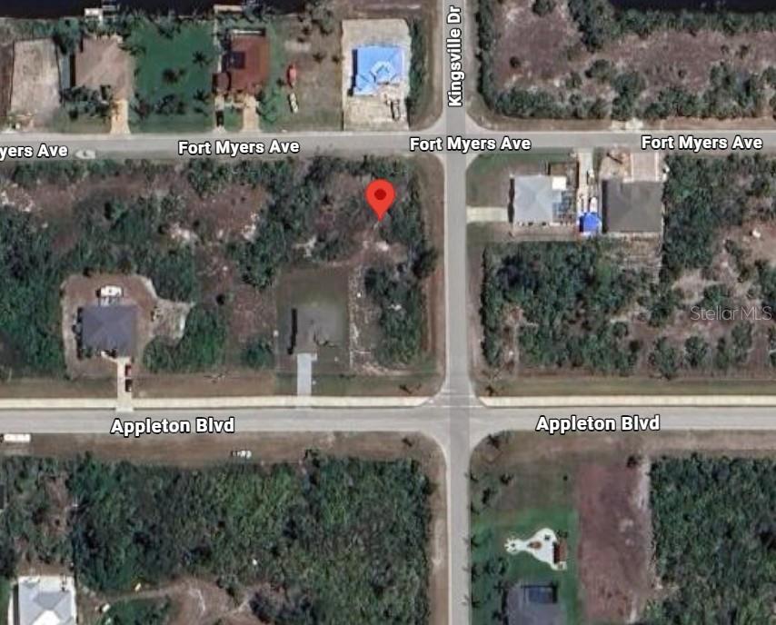 This is an aerial map view of a vacant lot marked with a red pin — 14159 FORT MYERS AVENUE, PORT CHARLOTTE, FL
