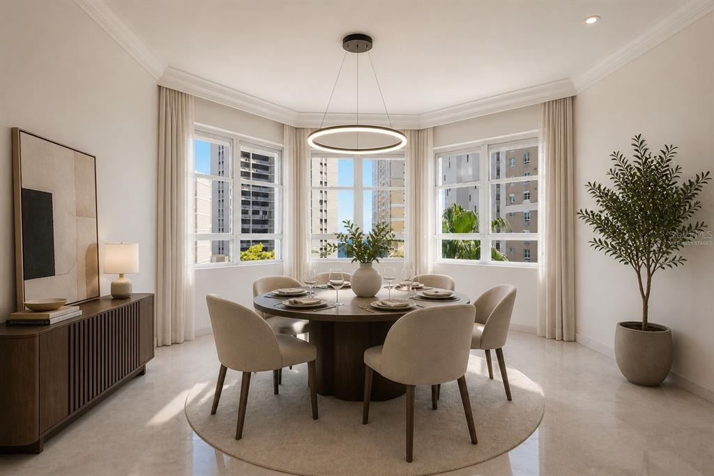 A dining room with a round table, six chairs, and large windows overlooking city buildings — 1754 MCCLEARY AVENUE UNIT 602, SAN JUAN, PR
