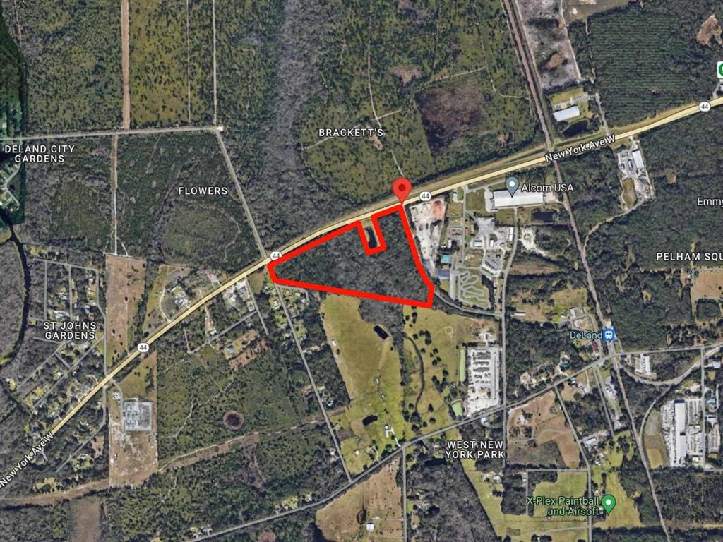 An aerial map view shows a parcel of land outlined in red along a highway — 44 W SR 44 NEW YORK AVENUE, DELAND, FL