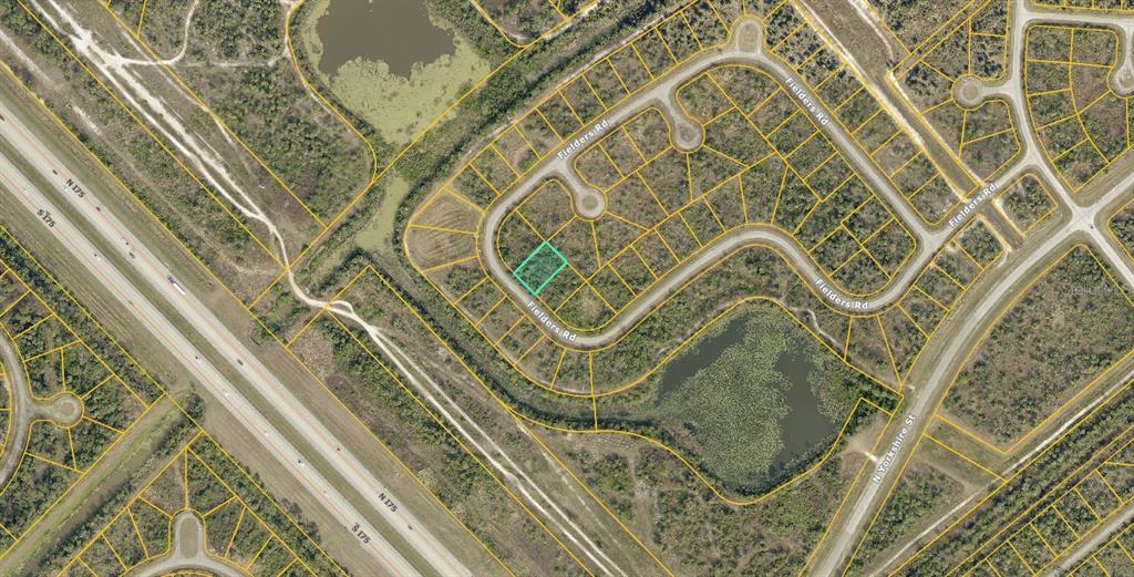This is an aerial map showing a highlighted vacant residential lot along a curved road — 1130219403 FIELDERS ROAD, NORTH PORT, FL