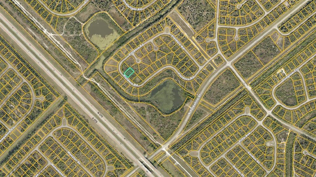 This map shows a residential neighborhood with a highlighted vacant lot on a curved street — 1130219403 FIELDERS ROAD, NORTH PORT, FL