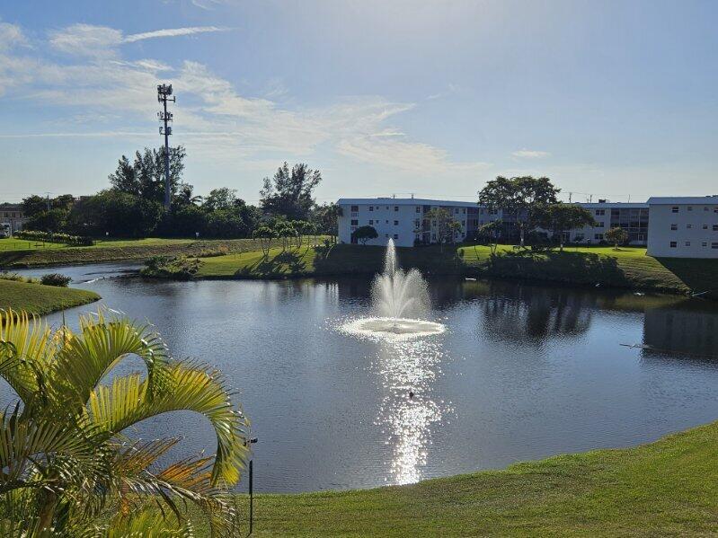 A fountain sprays water in the center of a pond surrounded by apartment buildings — 9818 Marina Boulevard, Boca Raton FL 33428, BOCA RATON, FL