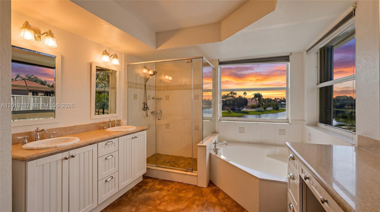 A dining room with a wooden table, chairs, and a staircase with a white railing — 4019 Turquoise Trl, Weston FL 33331, WESTON, FL