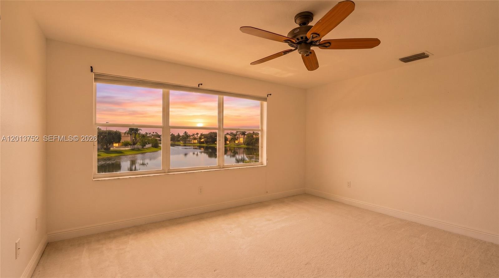 This is a digital rendering of a dining room featuring a staircase and lake view — 4019 Turquoise Trl, Weston FL 33331, WESTON, FL