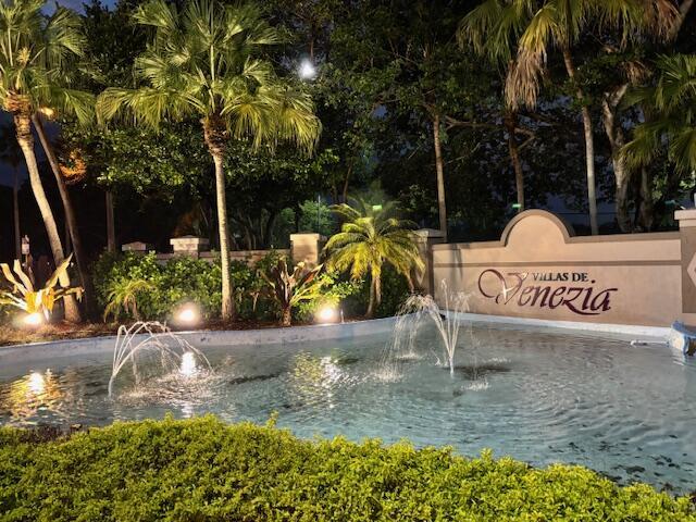 A fountain sits in front of a sign for Villas de Venezia at night — 9959 Nob Hill Place, Sunrise FL 33351, SUNRISE, FL