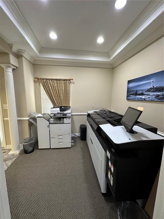 A small office room contains two large commercial printers and a wall-mounted lighthouse print — 8345 GUNN HIGHWAY, TAMPA, FL