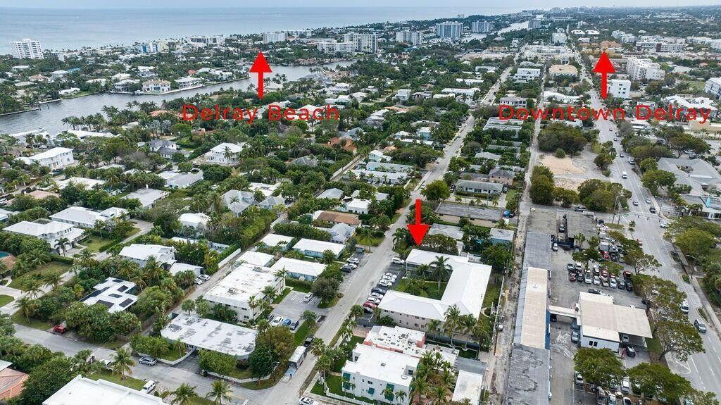 An aerial view shows a residential neighborhood in Delray Beach with buildings, streets, and trees — 426 NE 7th Avenue # 2b, Delray Beach FL 33483, DELRAY BEACH, FL