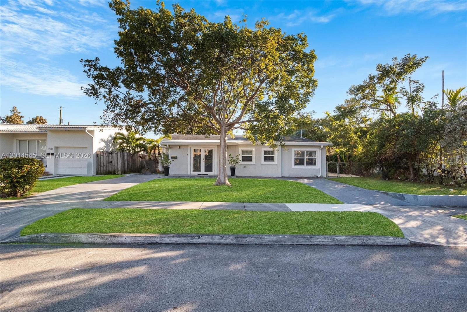 A single-story house with a large tree in the front yard and a paved driveway — 1946 SW 20th St # 1946, Miami FL 33145, MIAMI, FL