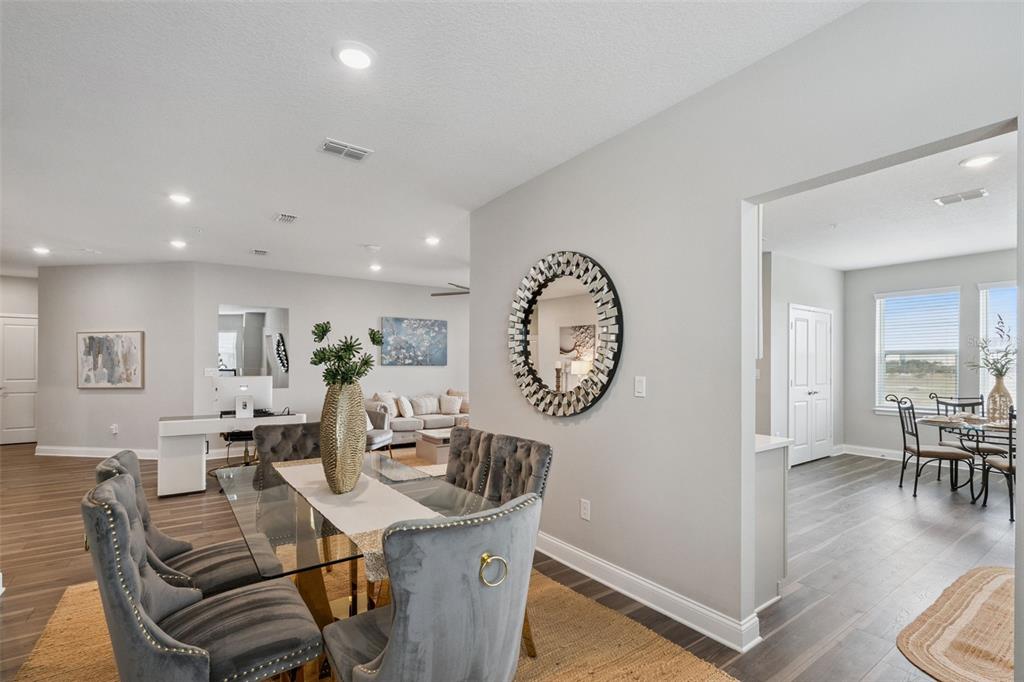 An aerial view of a multi-story apartment building with attached garages and a parking lot — 7521 LAUREATE BOULEVARD UNIT 5306, ORLANDO, FL