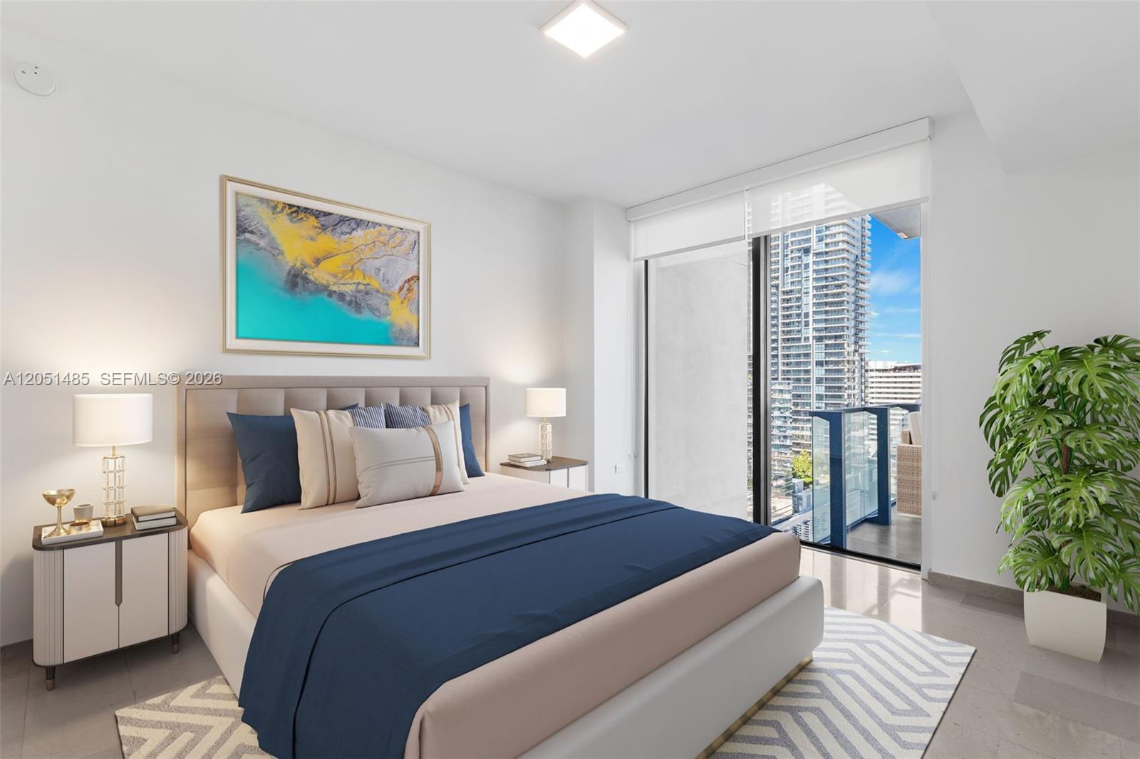 A modern bedroom features a bed with blue accents, bedside lamps, and a balcony view — 68 SE 6th St # 1706, Miami FL 33131, MIAMI, FL