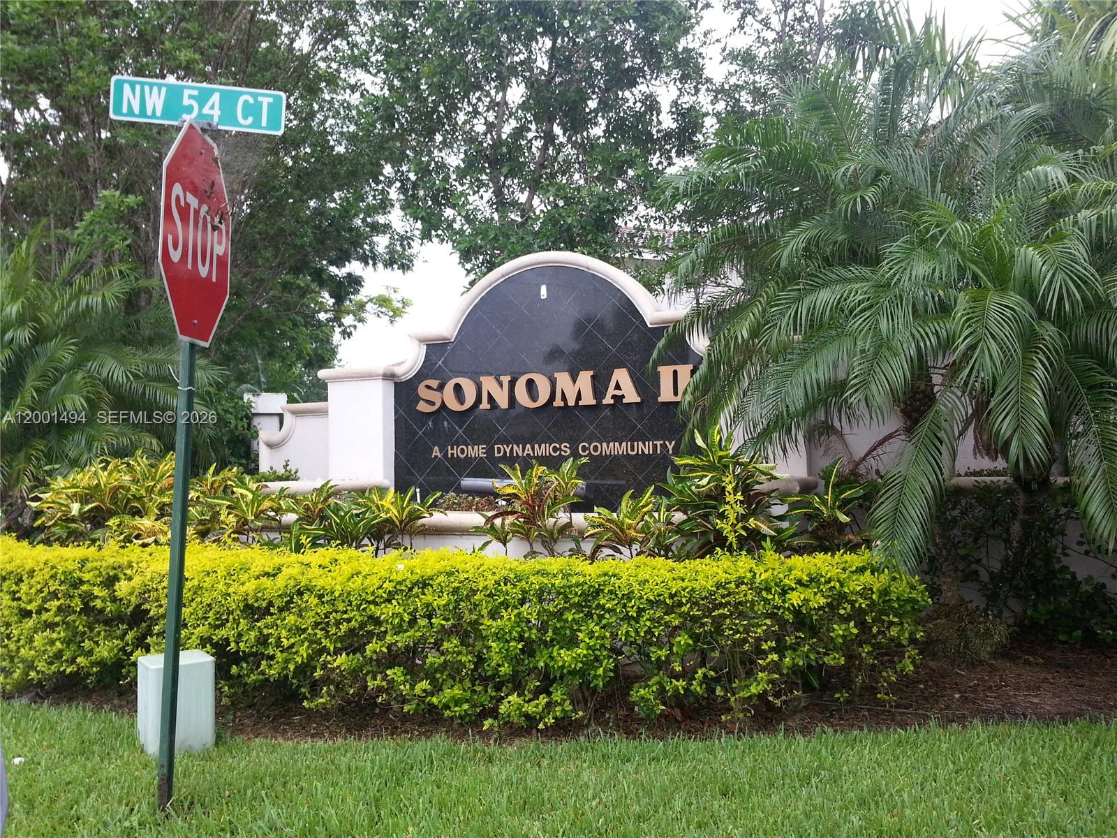 A sign for Sonoma II, a Home Dynamics community, stands behind a stop sign — 5450 NW 94th Ter, Sunrise FL 33351, SUNRISE, FL