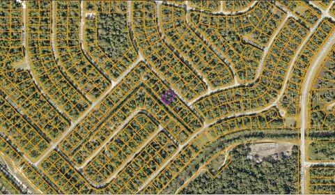 This is an aerial map showing a residential neighborhood with a highlighted vacant lot — CHINABOX STREET, NORTH PORT, FL