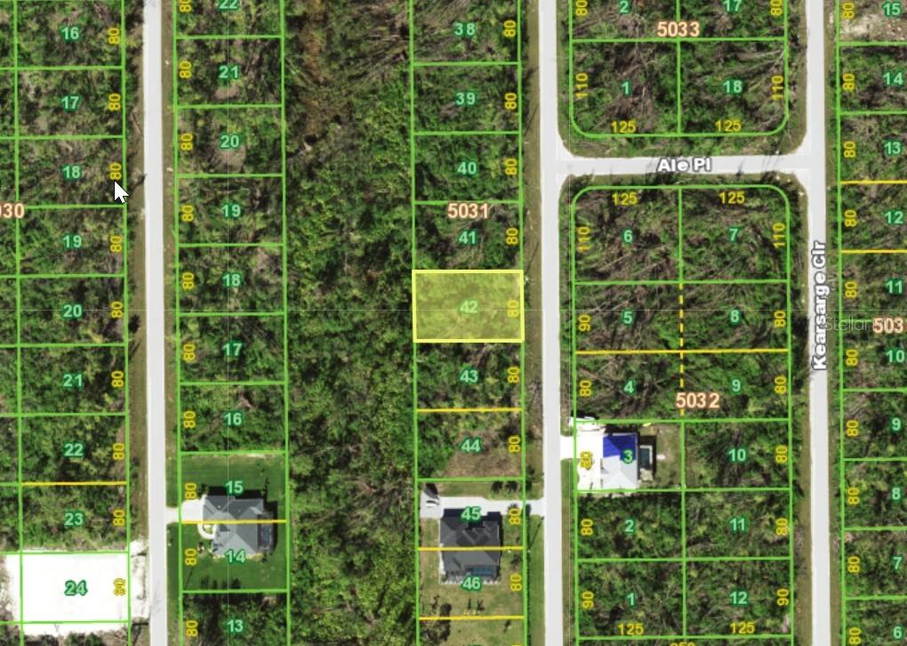 This is a satellite map showing a vacant residential lot highlighted in yellow — 10758 KEARSARGE CIRCLE, PORT CHARLOTTE, FL