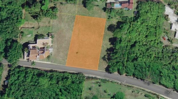 An aerial view shows a rectangular vacant lot highlighted in orange next to a residential street — B LA ROCA DEVELOPMENT LOT 190, FAJARDO, PR