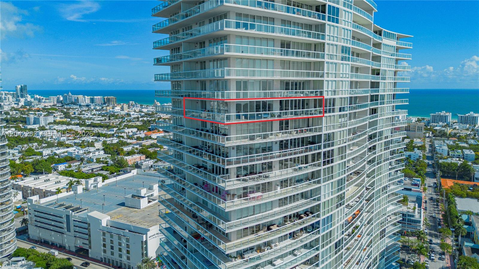An aerial view shows a high-rise residential building with a red-outlined balcony — 450 Alton Rd # 3301, Miami Beach FL 33139, MIAMI BEACH, FL