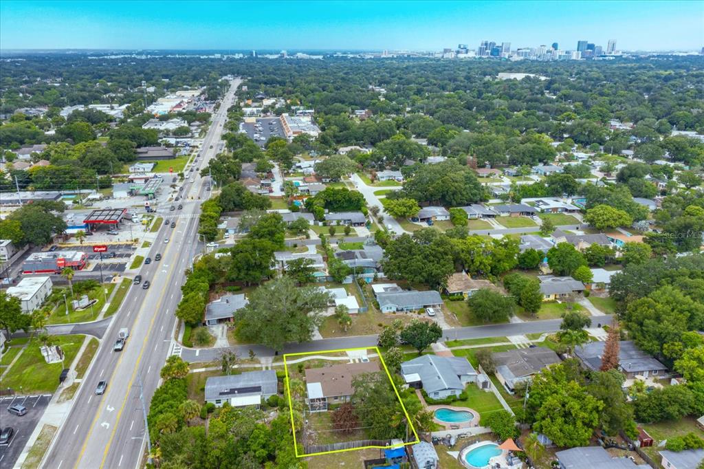 An aerial view shows a residential house with a fenced backyard and a swimming pool — 1519 CATALPA LANE, ORLANDO, FL