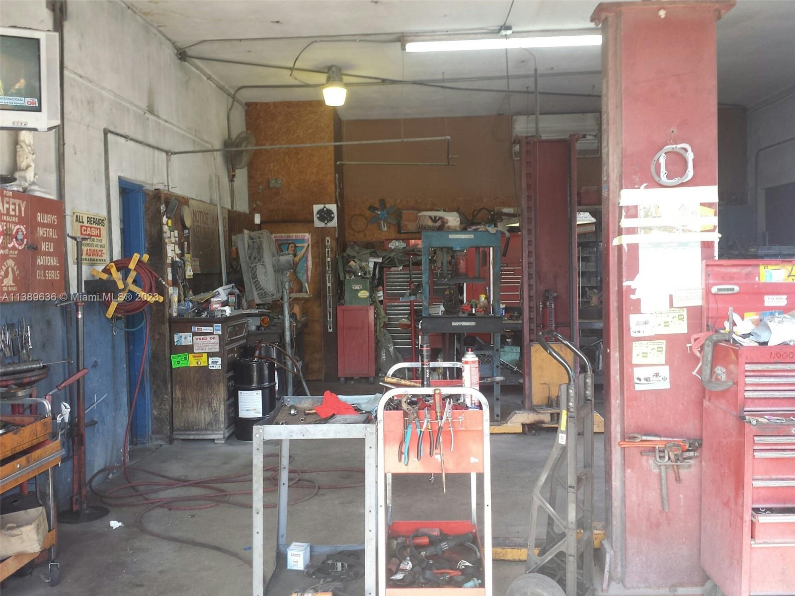 An interior view of an automotive repair shop featuring tools, workbenches, and equipment — 60 NW 20th St, Miami FL 33127, MIAMI, FL