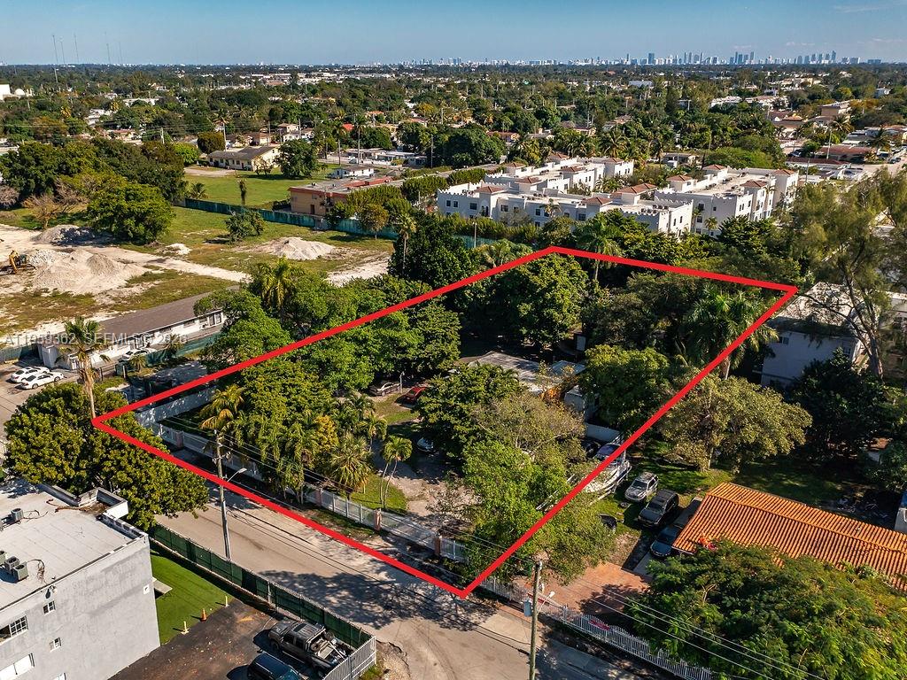 An aerial view shows a rectangular lot with trees and a small building outlined in red — 13265 Alexandria Dr, Opa-Locka FL 33054, OPA-LOCKA, FL
