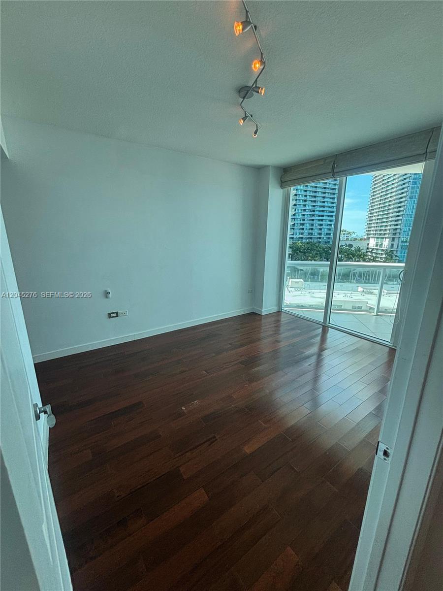 A bathroom features a vessel sink on a marble vanity, a toilet, and a shower-tub combo — 480 NE 30th St # 1004, Miami FL 33137, MIAMI, FL
