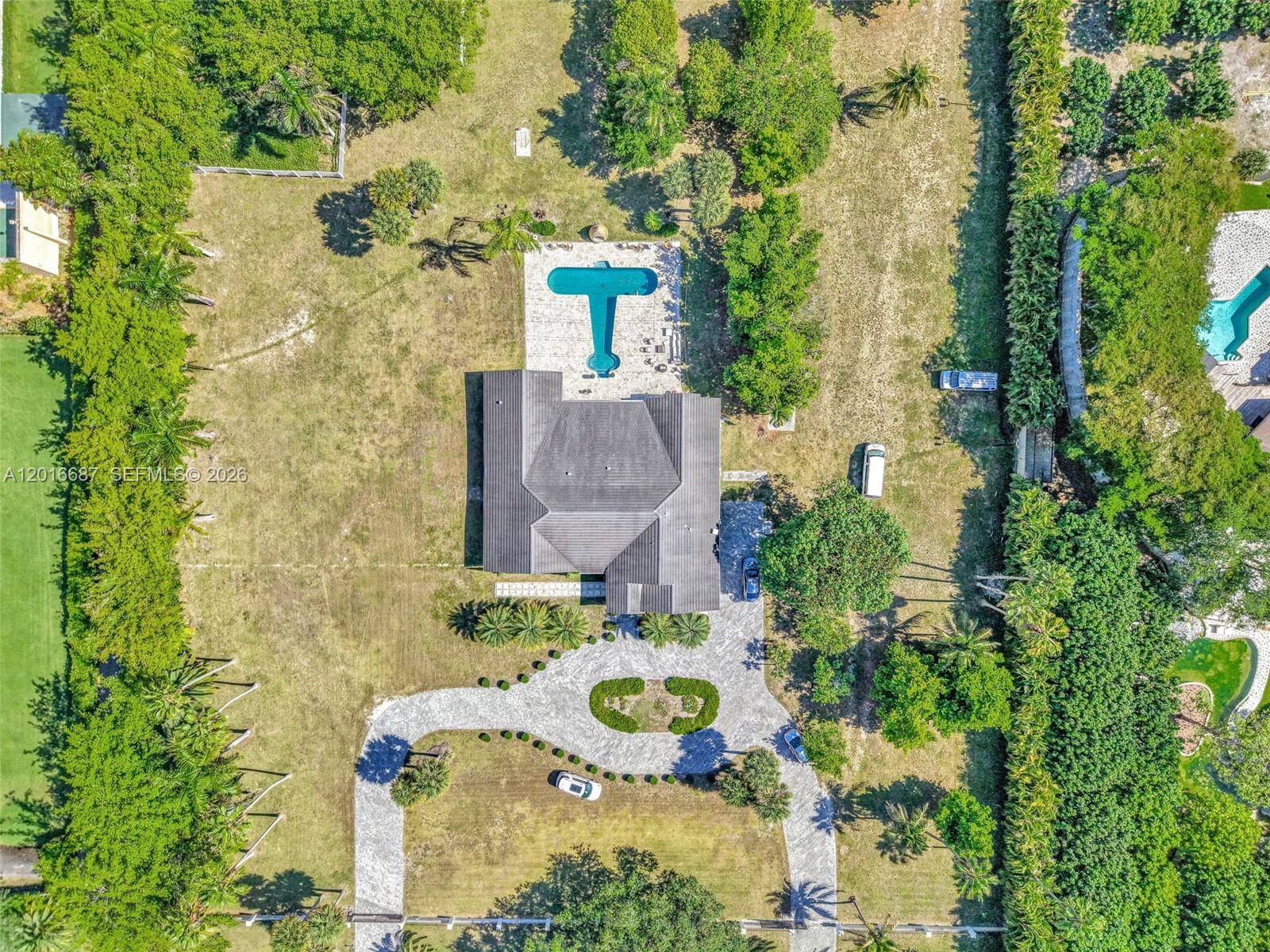 An aerial view shows a house with a pool, circular driveway, and surrounding trees — 17795 SW 158th St, Miami FL 33187, MIAMI, FL