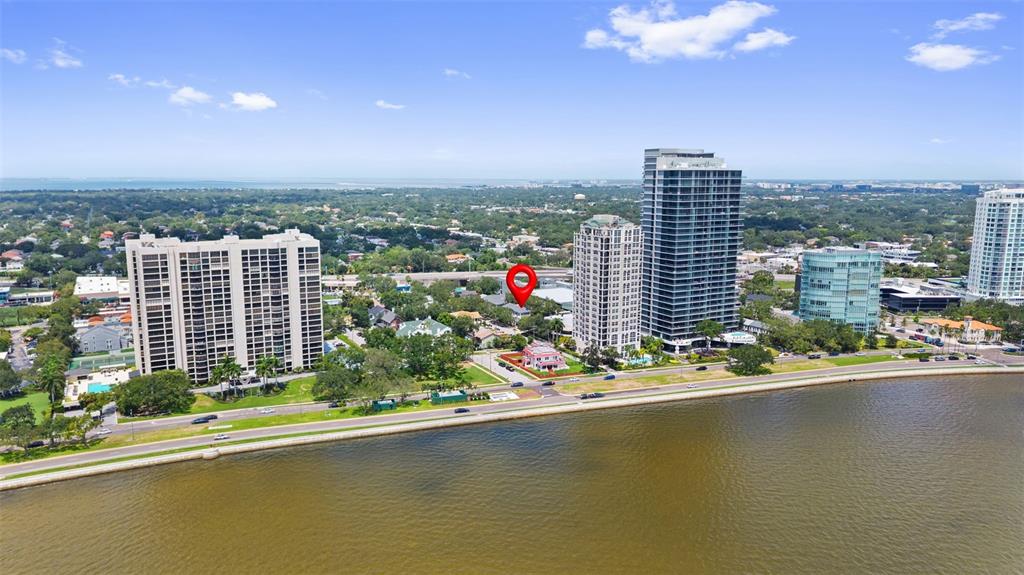 An aerial view shows a pink house marked by a pin near a waterfront road — 3007 W MASON STREET UNIT A, TAMPA, FL