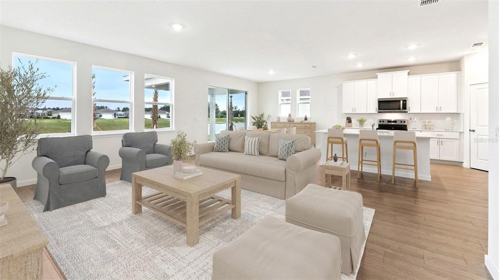 This is a digital rendering of an open-concept living room and kitchen with light flooring — 300 BRACER WAY, ORMOND BEACH, FL