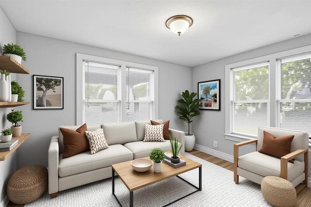 A living room features a beige sofa, an armchair, a coffee table, and wall shelving — 2550 10TH AVENUE S, ST PETERSBURG, FL