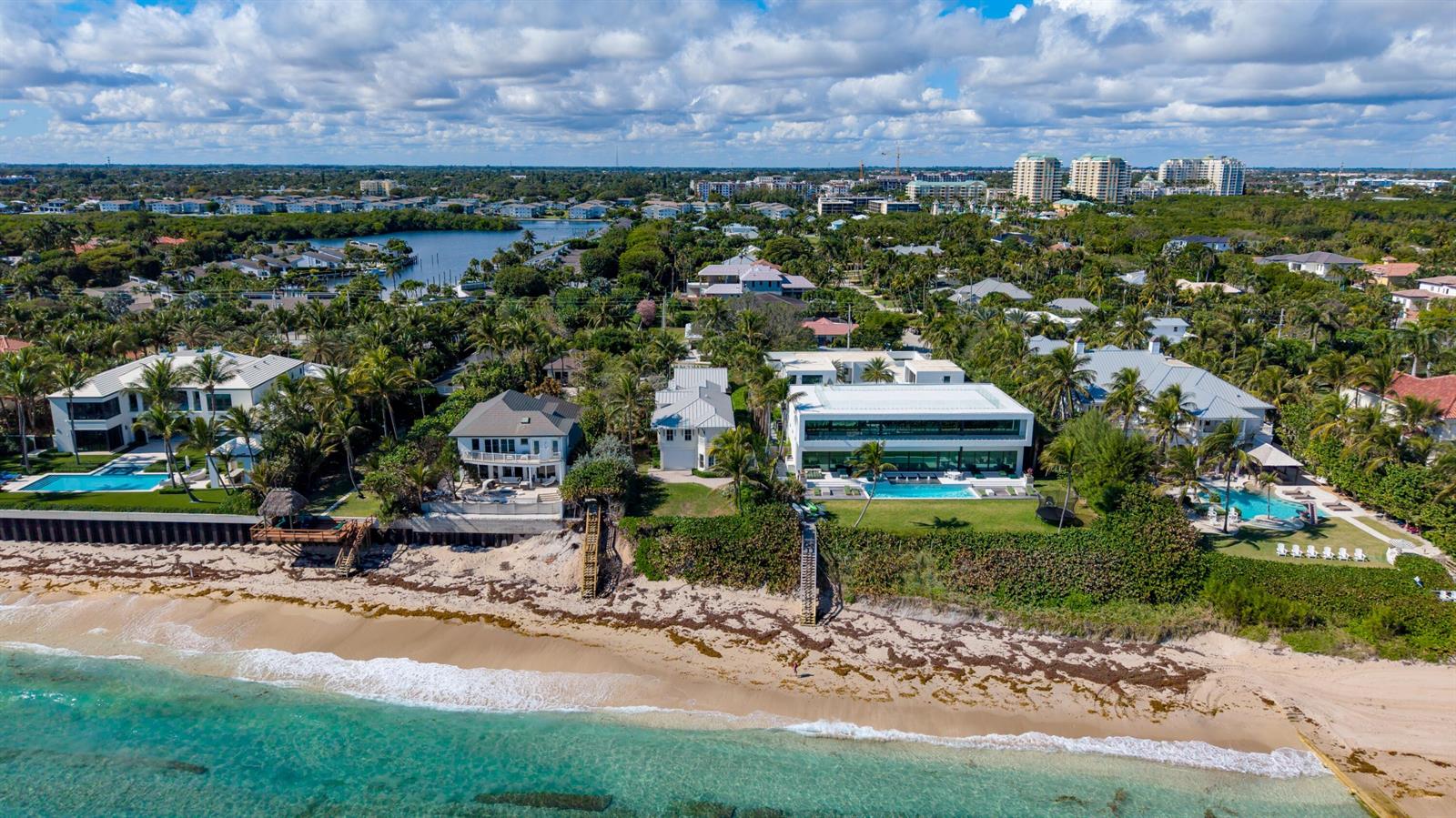 An aerial view shows several luxury beachfront homes with swimming pools along a sandy coastline — 6201 N Ocean Boulevard, Ocean Ridge FL 33435, OCEAN RIDGE, FL
