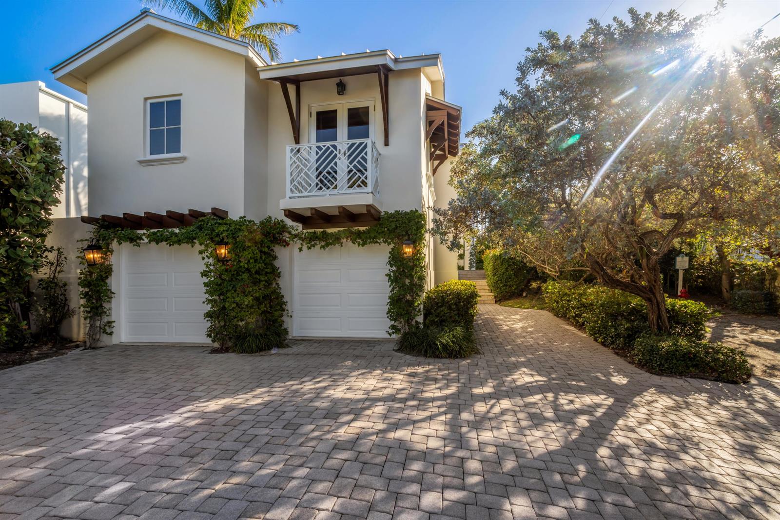 A two-story house with a two-car garage, a balcony, and a paved driveway — 6201 N Ocean Boulevard, Ocean Ridge FL 33435, OCEAN RIDGE, FL
