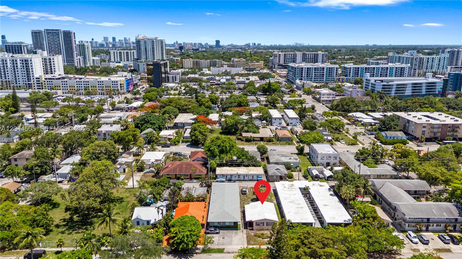 An aerial view shows a single-story house marked with a red pin in a neighborhood — 1938 Pierce St, Hollywood FL 33020, HOLLYWOOD, FL