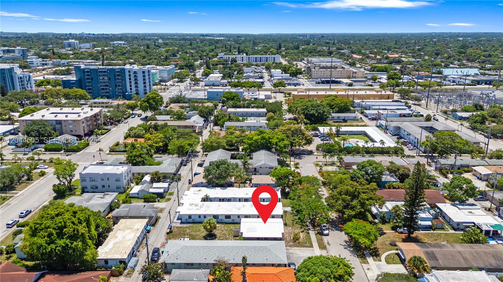 An aerial view shows a multi-unit residential building with a red location pin — 1938 Pierce St, Hollywood FL 33020, HOLLYWOOD, FL