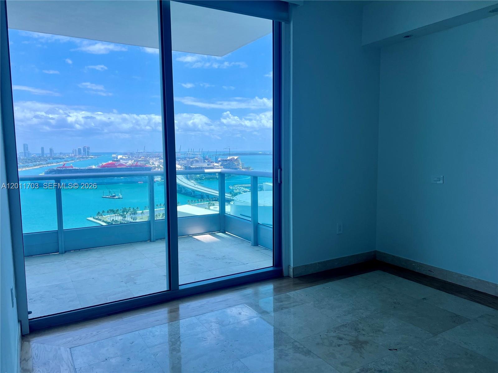 A view of a cruise ship and the ocean from a high-rise balcony — 900 Biscayne Blvd # 2904, Miami FL 33132, MIAMI, FL