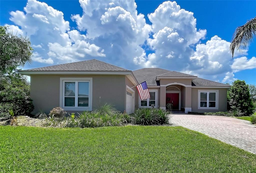 This is a floor plan for a single-story home with four bedrooms and a garage — 408 TALAMONE DRIVE, WINTER HAVEN, FL