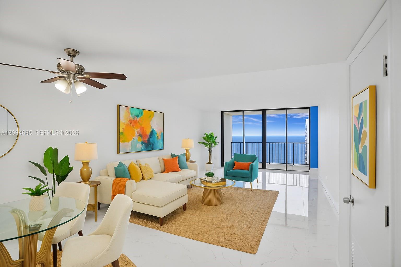 A bright living room features white tile floors, a sectional sofa, and a balcony view — 2401 S Ocean Dr # 2402, Hollywood FL 33019, HOLLYWOOD, FL