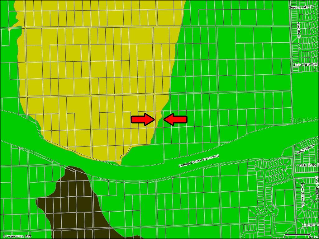 This is a map showing property boundaries and land use zones with arrows indicating a specific parcel — Vacant Land on INTERNATIONAL DRIVE S, ORLANDO, FL