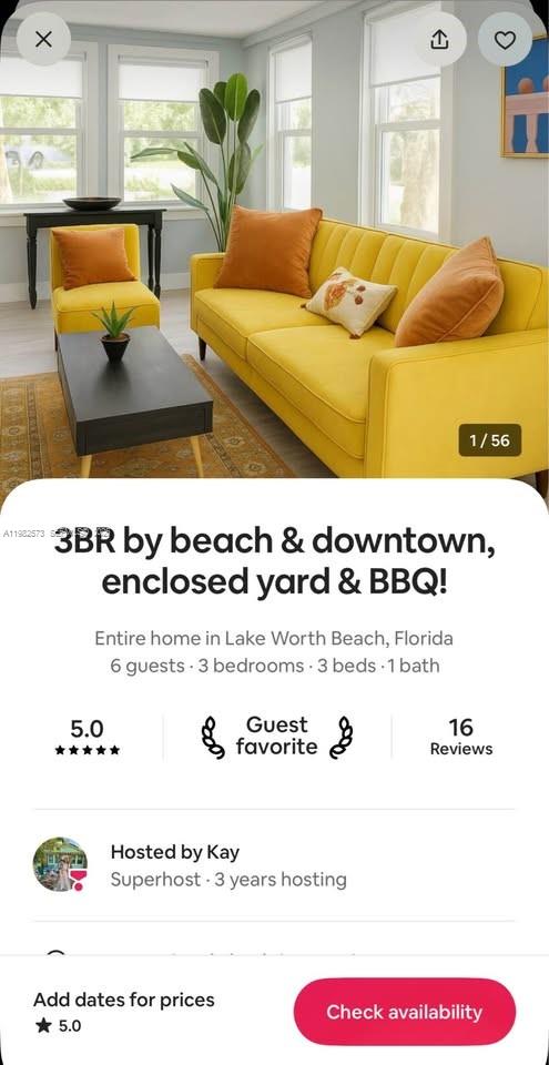 A yellow sofa and matching armchair sit in a living room with a coffee table — 213 N E St, Lake Worth FL 33460, LAKE WORTH, FL