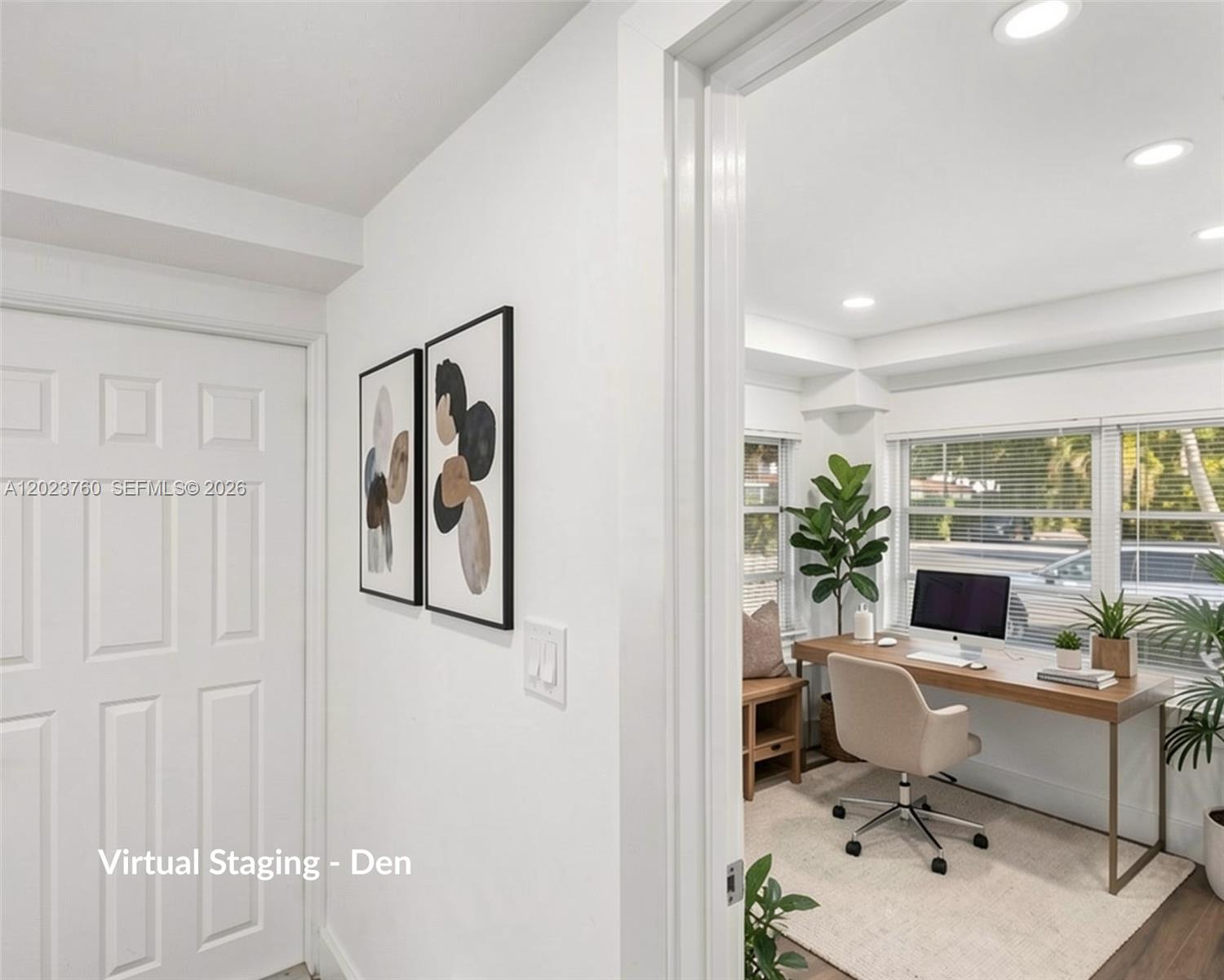 A view through a doorway into a home office featuring a desk and two windows — 900 Tangier St, Coral Gables FL 33134, CORAL GABLES, FL