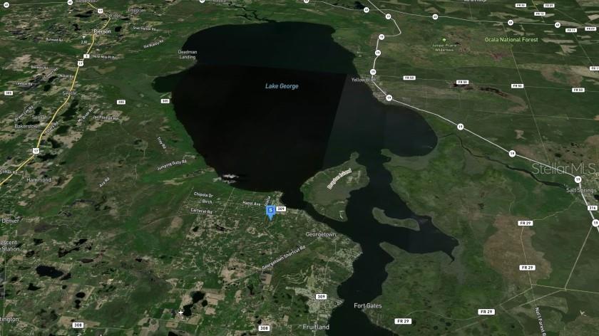 This is an aerial map view showing Lake George and the surrounding Florida landscape — 138 MOSSWOOD STREET, GEORGETOWN, FL