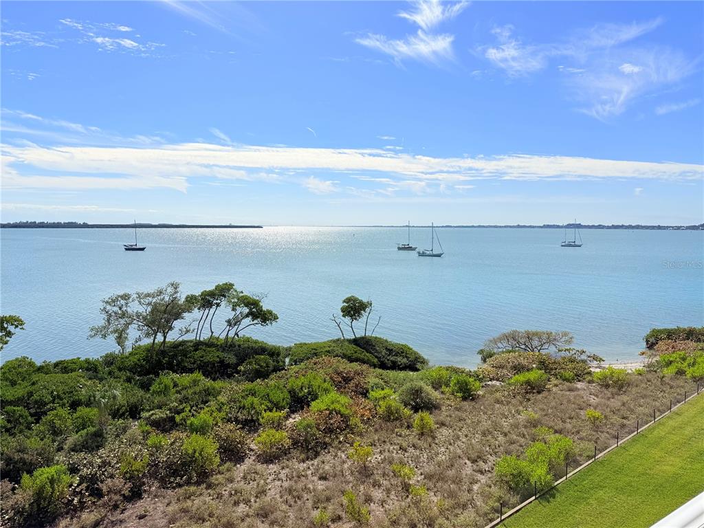 A view of a calm bay with several sailboats under a bright blue sky — 29 HARBOUR ISLE UNIT PH01, HUTCHINSON ISLAND, FL