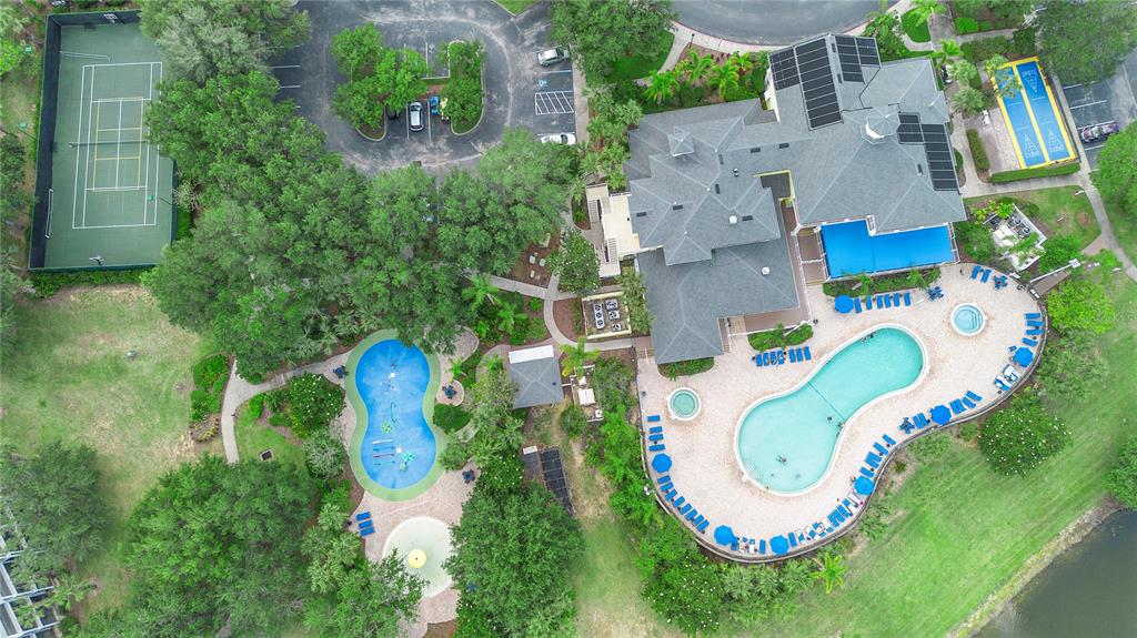 An aerial view shows a clubhouse with a swimming pool, tennis court, and shuffleboard court — 607 GRAN BAHAMA BOULEVARD UNIT B29/U607, DAVENPORT, FL