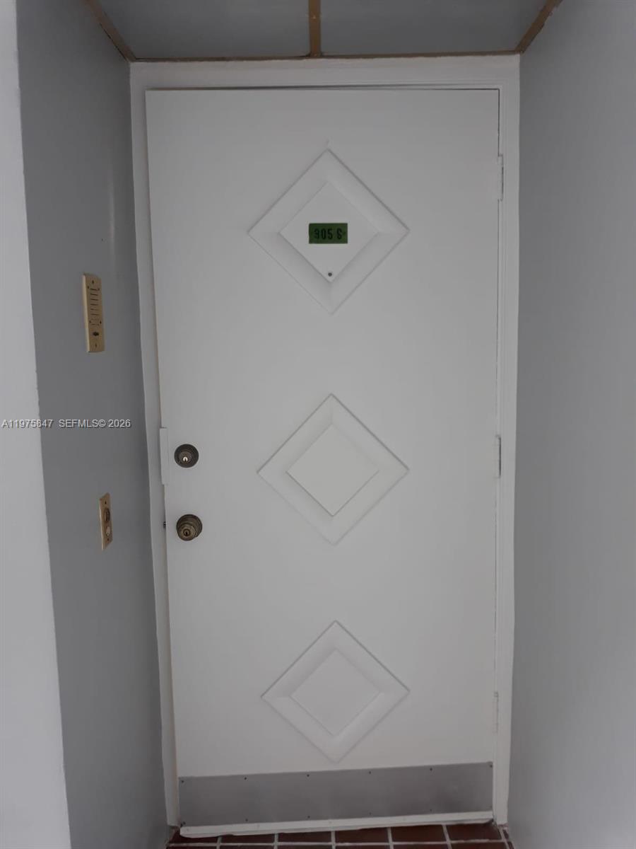 A white door with three diamond-shaped panels and a metal kickplate — 329 SE 3rd St # 305S, Hallandale Beach FL 33009, HALLANDALE BEACH, FL
