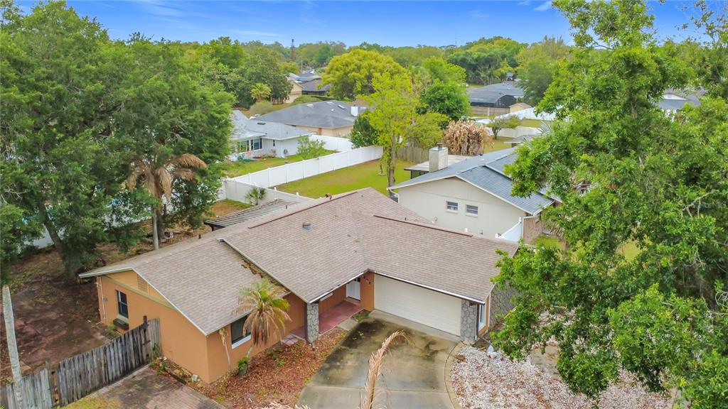 An aerial view of a single-story house with a shingled roof and attached garage — 5503 ALBERT DRIVE, WINTER PARK, FL