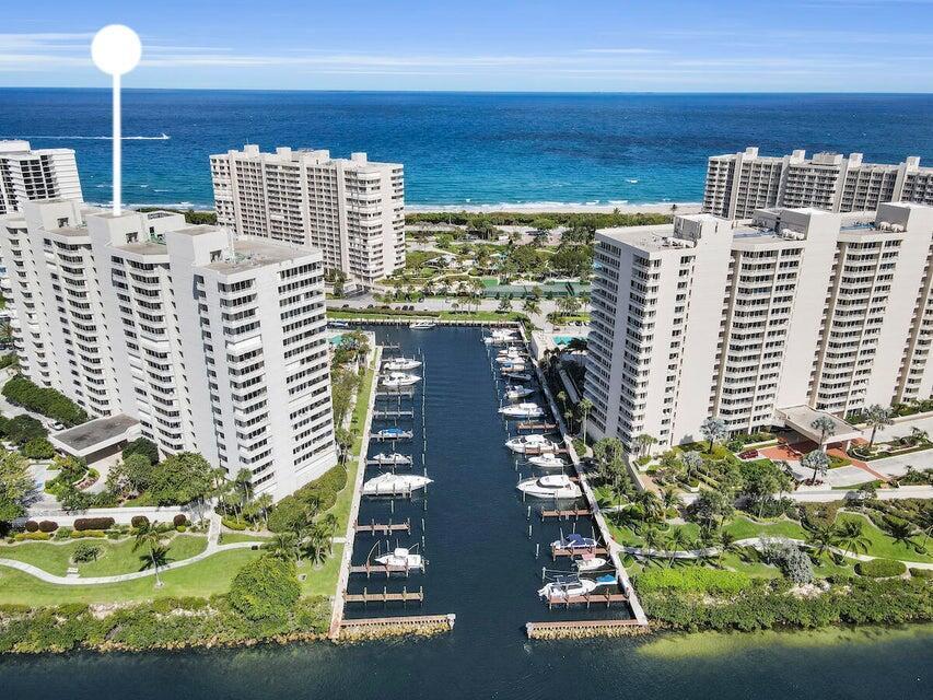 Aerial view of a waterfront condominium complex with a private marina and ocean views — 4201 N Ocean Boulevard # 1605, Boca Raton FL 33431, BOCA RATON, FL