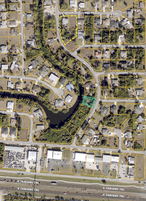 This is an aerial map showing a vacant lot highlighted in blue within a residential neighborhood — TBD ESPANOLA DRIVE, NORTH PORT, FL