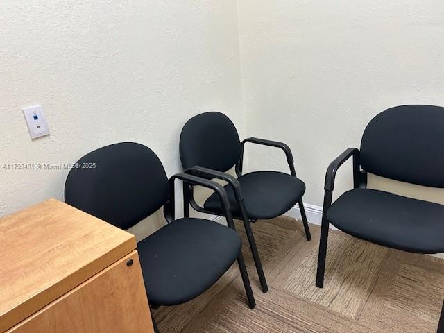 Three black office chairs are arranged in a corner with beige walls and carpeted flooring — 7601 Davie Road Ext, Davie FL 33024, DAVIE, FL