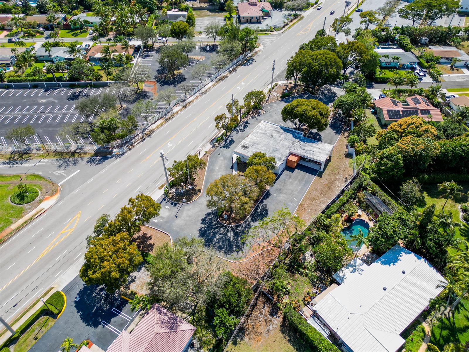 An aerial view shows a commercial building with a parking lot next to a road — 2419 S Seacrest Boulevard, Boynton Beach FL 33435, BOYNTON BEACH, FL